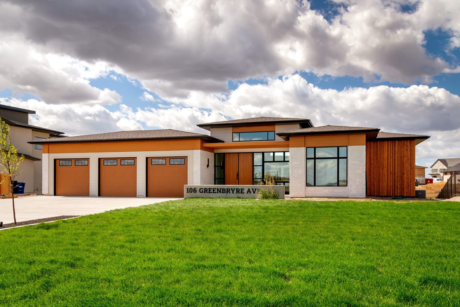 Prairie-style bungalow with a three-car garage and cedar accents in Greenbryre
