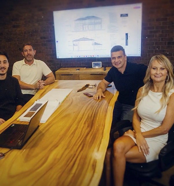 The Decora Homes team around a boardroom table