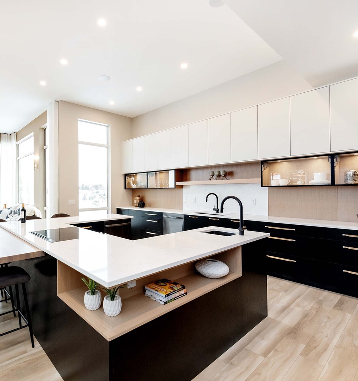 Bright kitchen with a white quartz island, pendant lights and full-height cabinetry